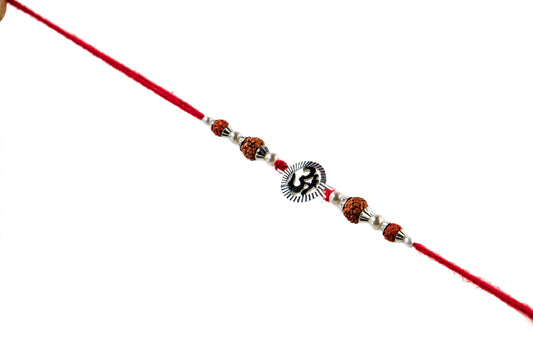 Traditional Silver Rakhi with Oval Om  Motif - White background