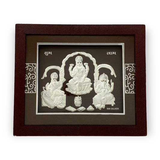 Front view of exquisite 7x5 inch 999 pure silver Trimurti (Laxmi Ganesh Saraswati) frame by Hem Jewels		