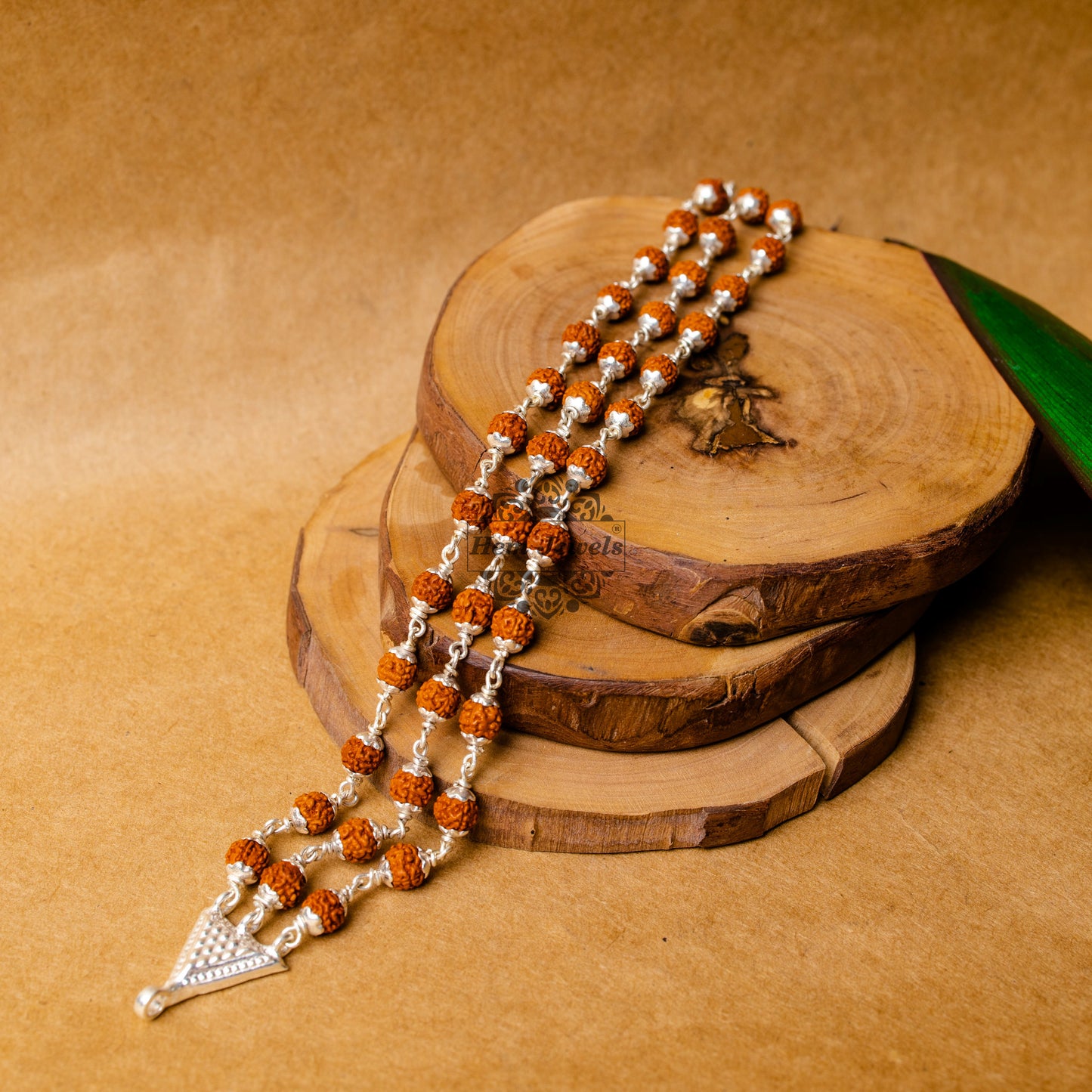 View showing Silver Rudraksha Rakhi with Classic Triple Line Rudraksh