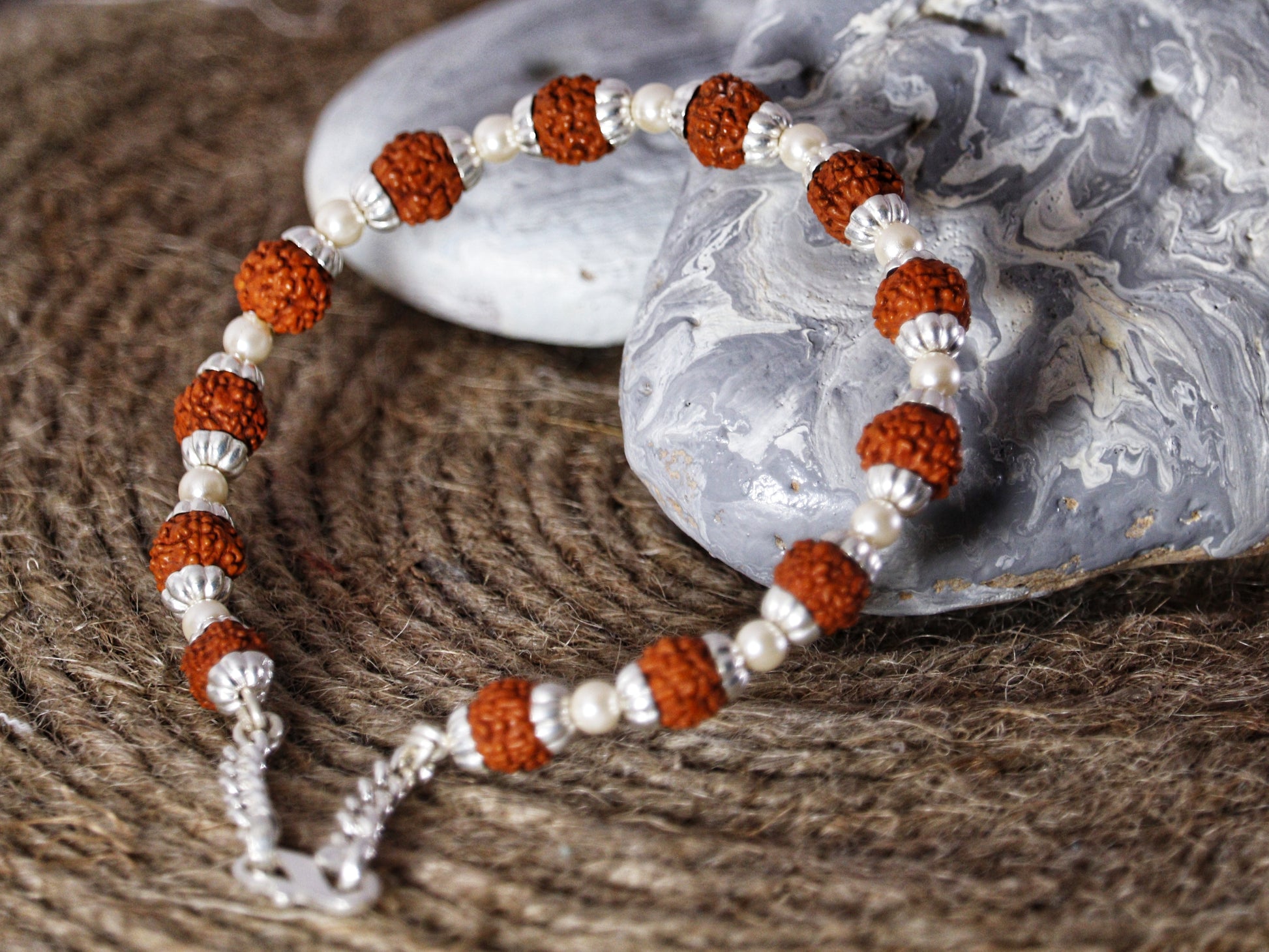 View showing Silver Rudraksha Rakhi with  Rudraksh and Pearl Combo Motif