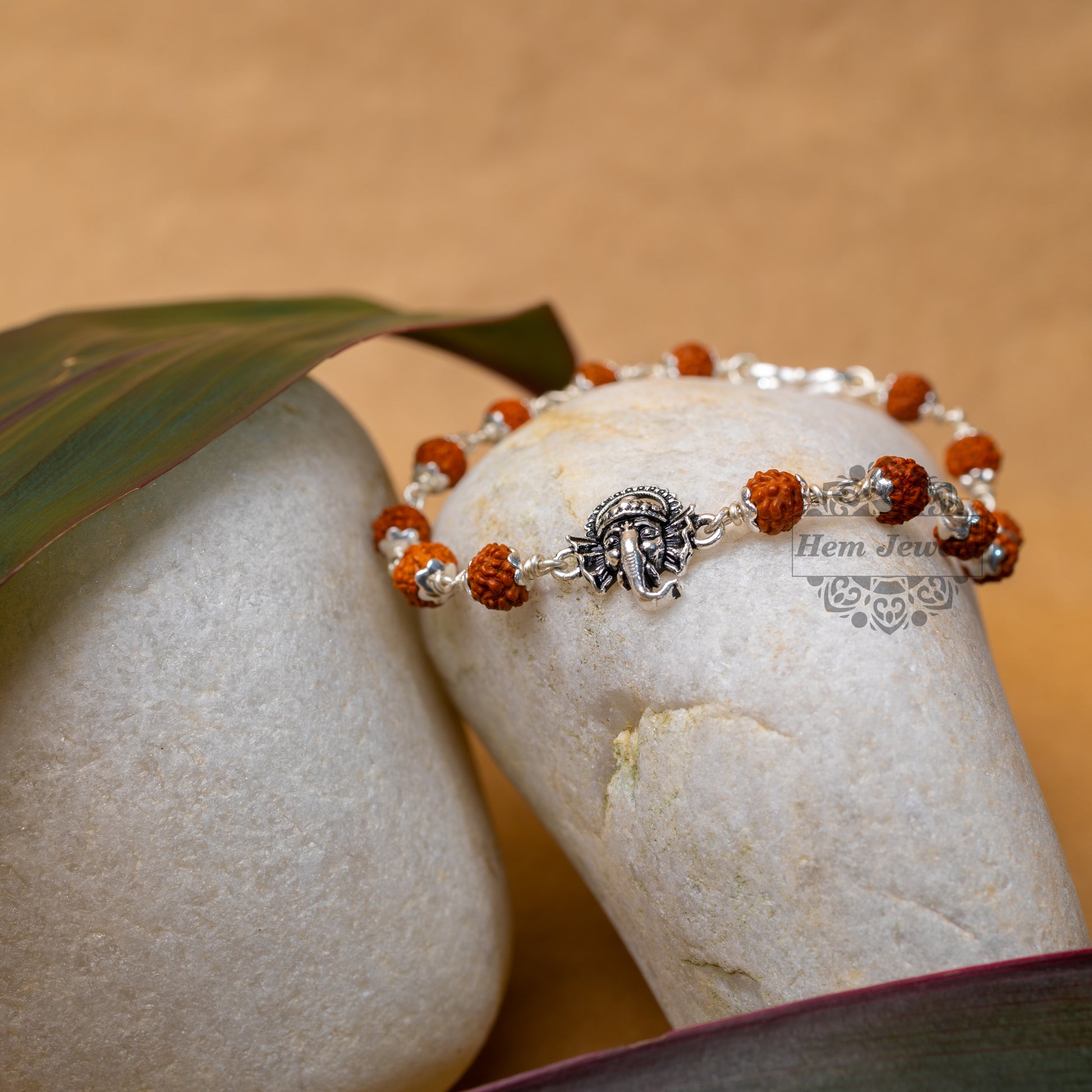 Silver Rudraksha Rakhi with  Motif of Ganesh Face - Motif Close Up